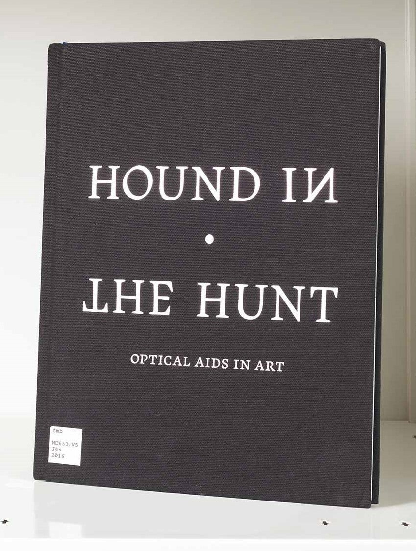 Black book cover featuring the stylized words "Hound in the Hunt"