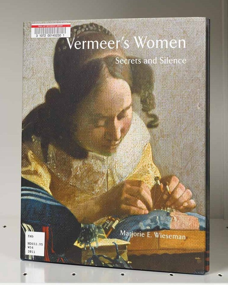 Book cover featuring a painting detail of a woman making lace