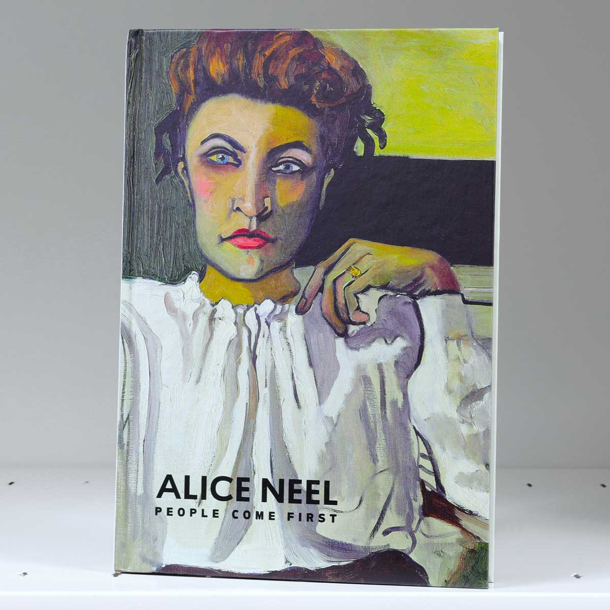 Book cover featuring a multicolored modernist portrait of a woman in a white blouse