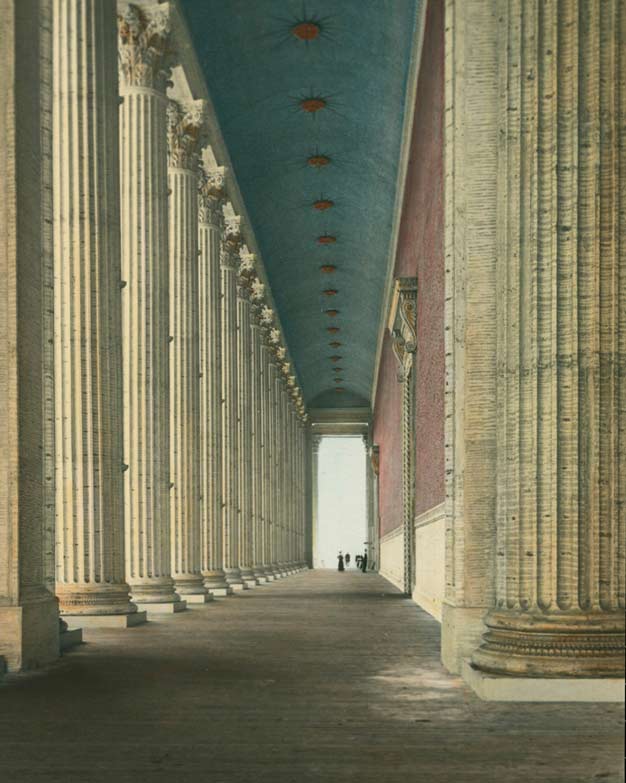 colorized photograph of a walkway lined with columns