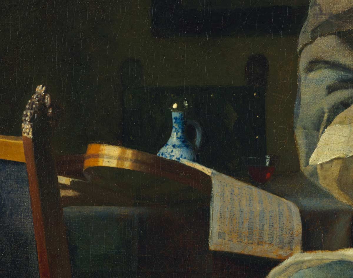 Painting detail of blue-and-white porcelain on a table in front of a musical instrument and a sheet of music