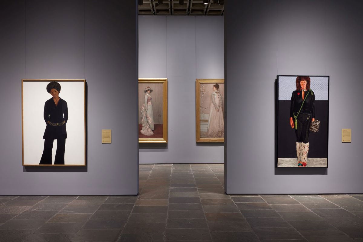 Two modern portraits of women flanking a gallery with two late nineteenth-century portraits of women in pink dresses