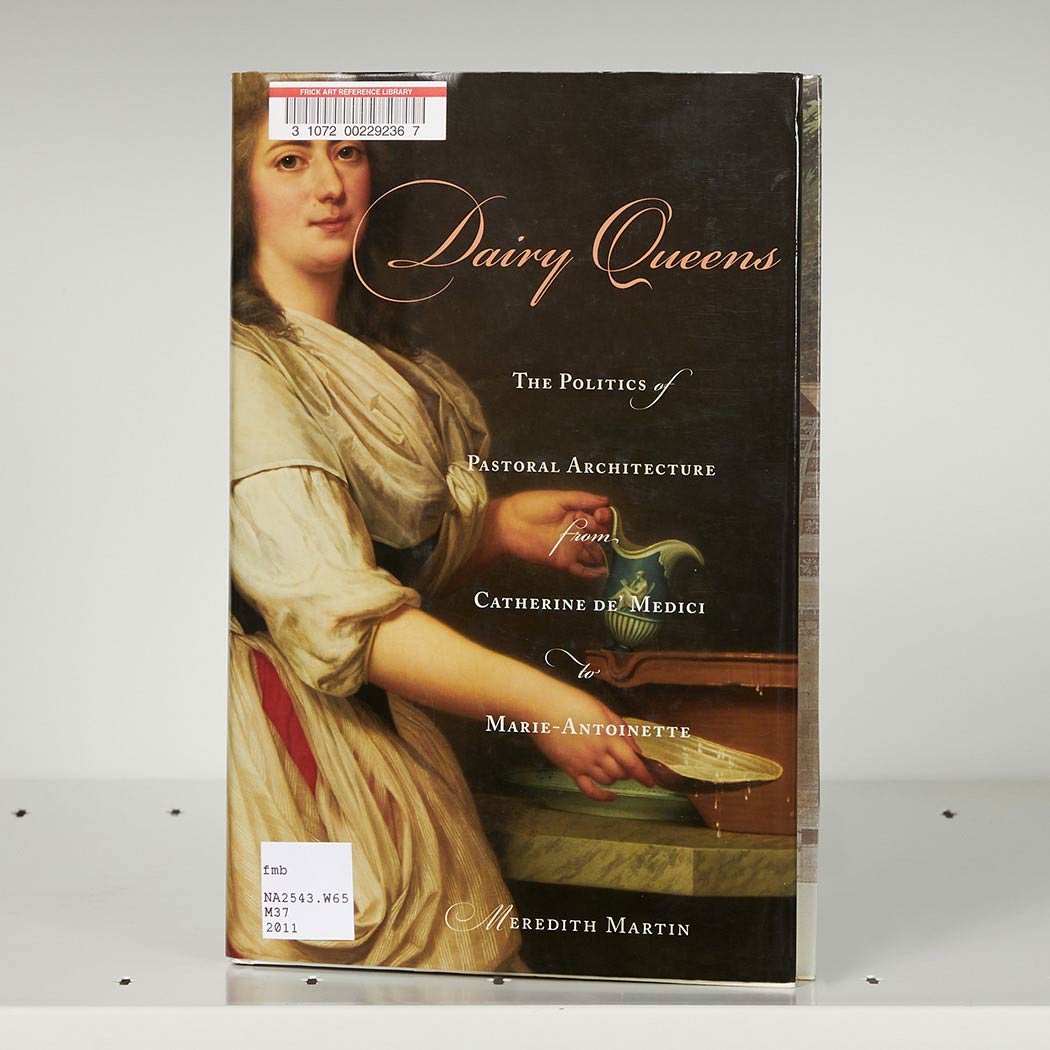 Book cover on a white shelf featuring a painting of an aristocratic French woman holding porcelain objects