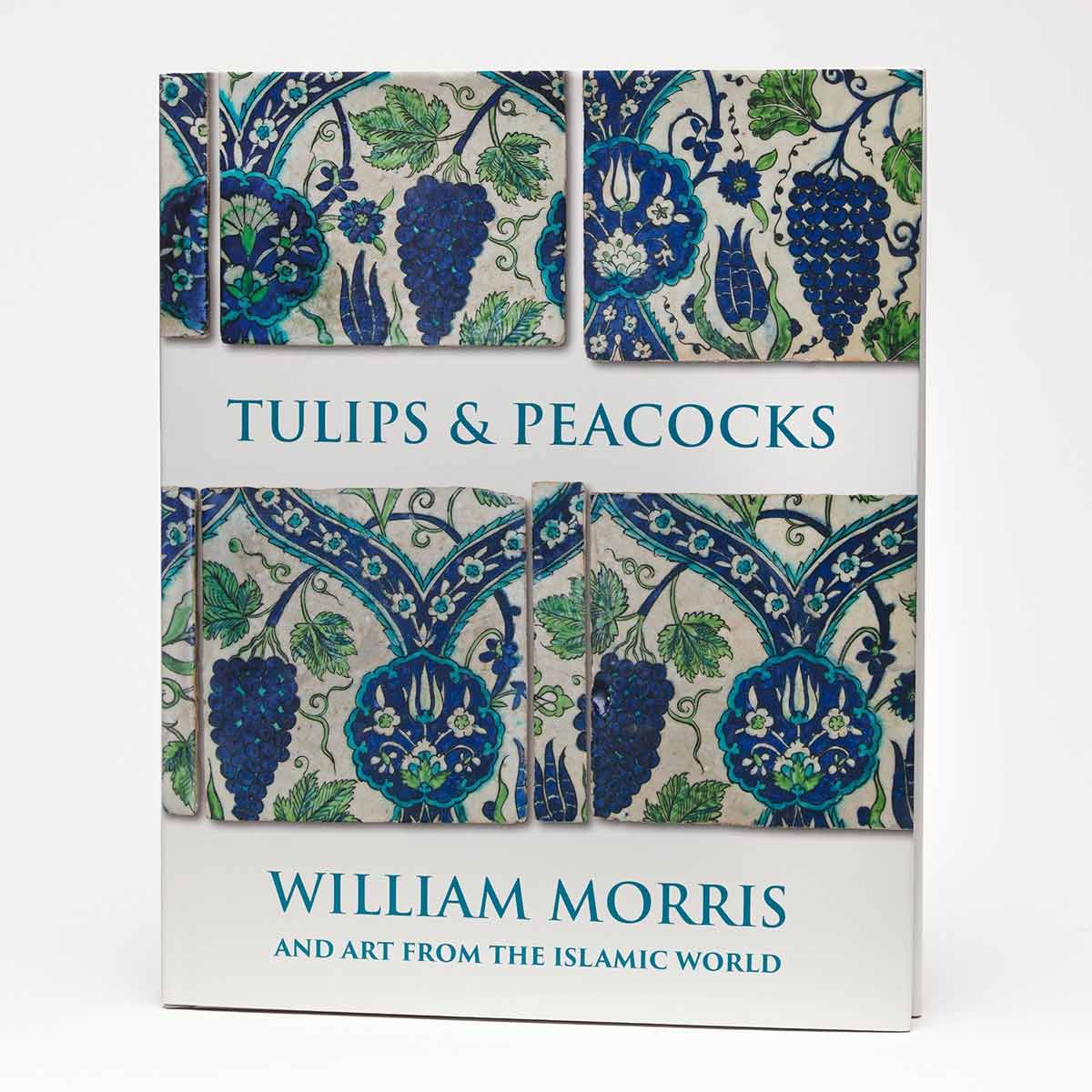 Book cover featuring a blue-and-green Islamic-style design with motifs of grapes, flowers, and vines