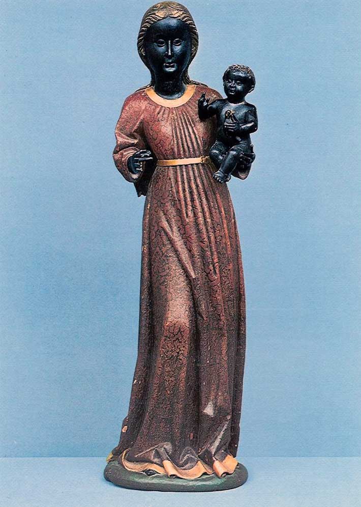 Color photograph of a polychromed sculpture of the Virgin and Child.