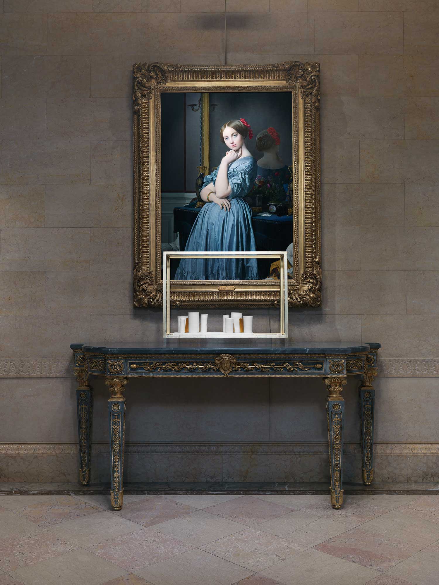 photo of white sculpture in front of painting of young woman standing in blue dress