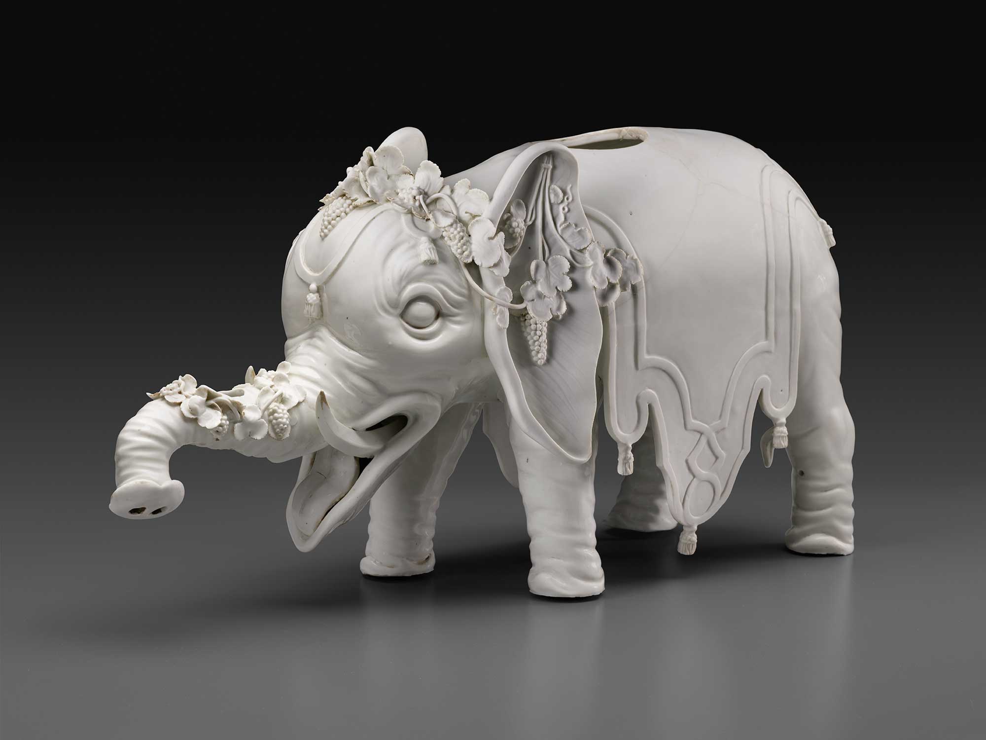 photo of white porcelain elephant wine dispenser 