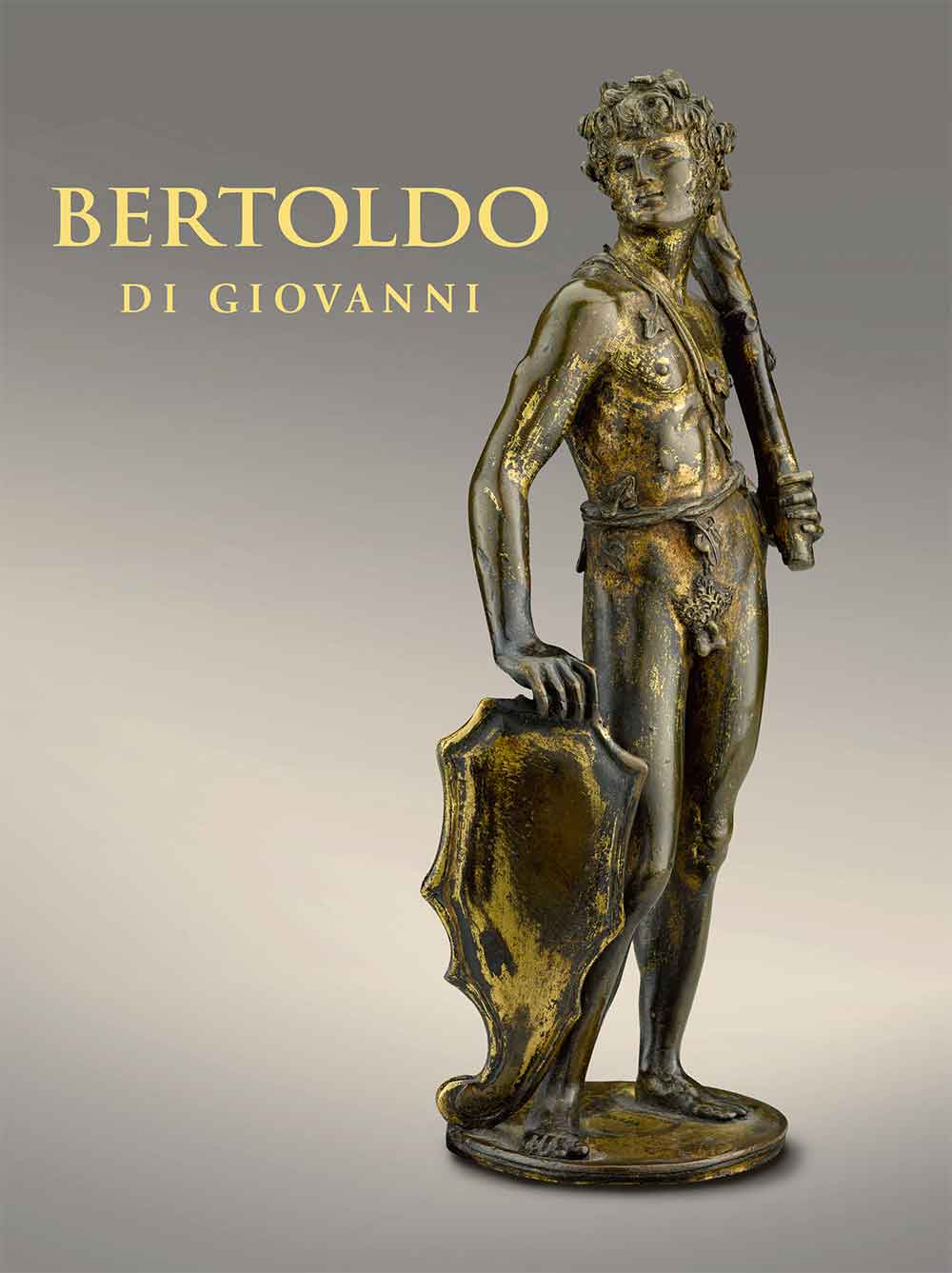 cover of book displaying statuette of man holding club and shield