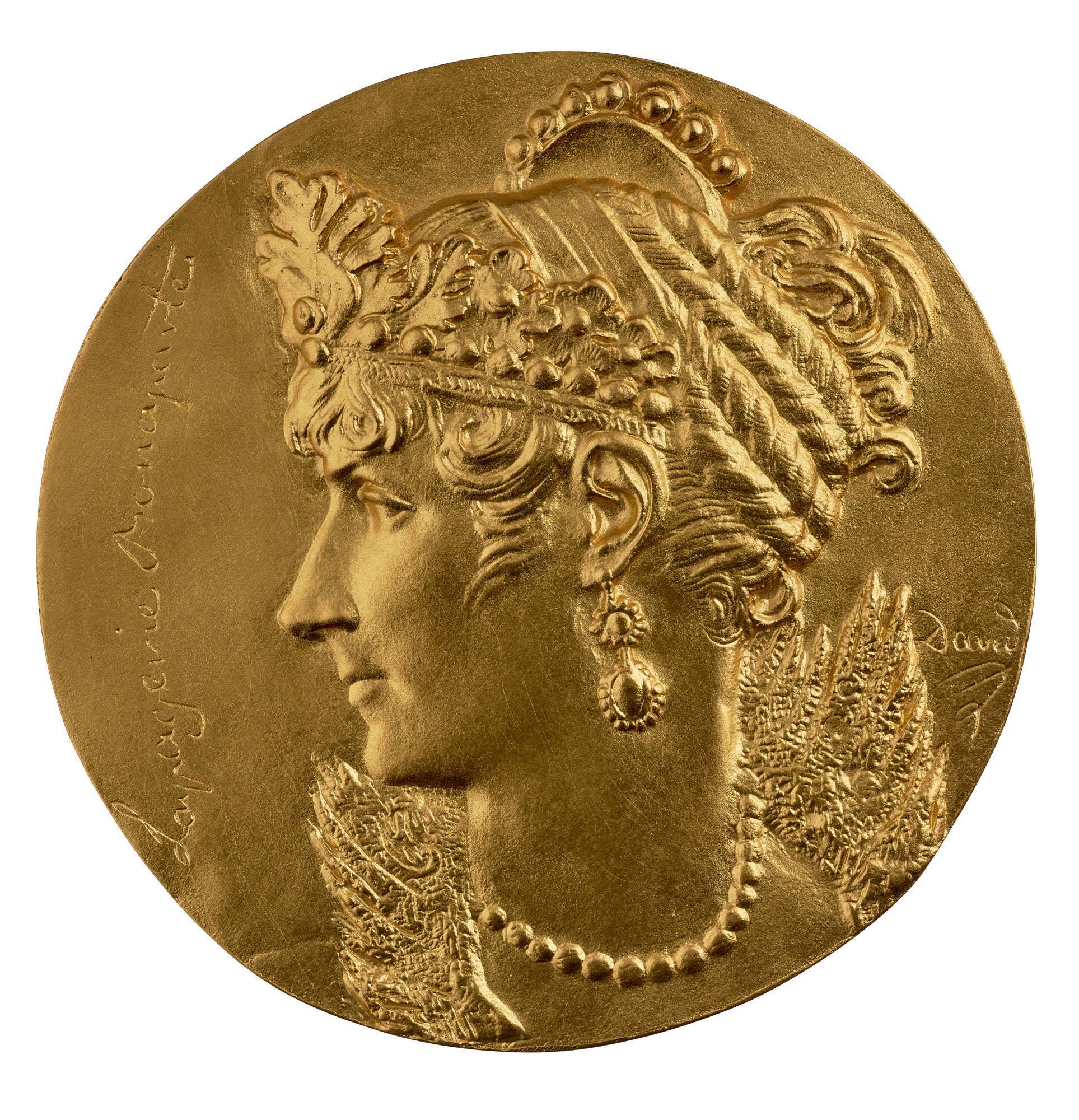 photo of gold medal with woman's face in profile, wearing elaborate hair and neck piece