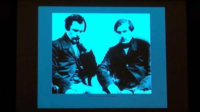 video still of black and white photo of two men, Goncourt brothers, sitting 