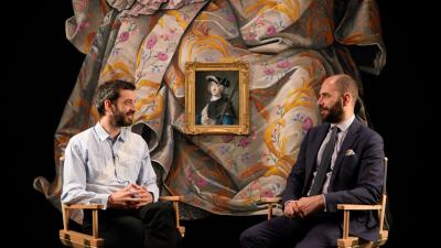 video still of Nicolas Party and Xavier Salomon seated in front of paintings