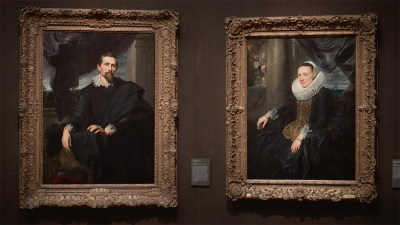 two oil portraits by Van Dyck, one of a man and another of a woman, both wearing black