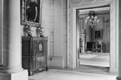 photo of hallway with with painting, table, chandelier, circa 1927