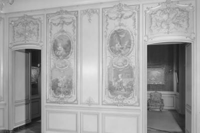 photo of wall with paintings in panels and two doorways, circa 1963