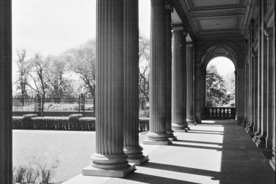 photo of portico, or stone porch walkway with columns, next to garden,  circa 1927