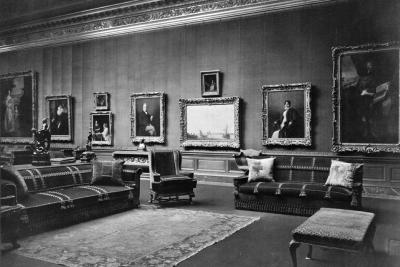 photo of gallery with paintings, sculptures, couches and chair, circa 1927
