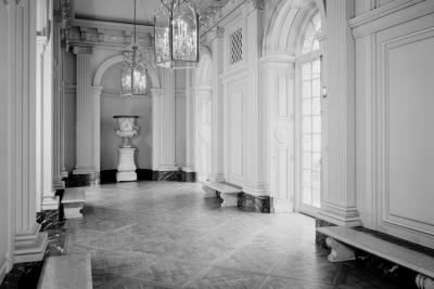 photo of hall with chandeliers, benches, glass doors, circa 1977