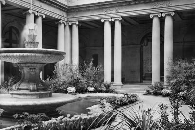 photo of garden court with columns, fountain and plants, circa 1940