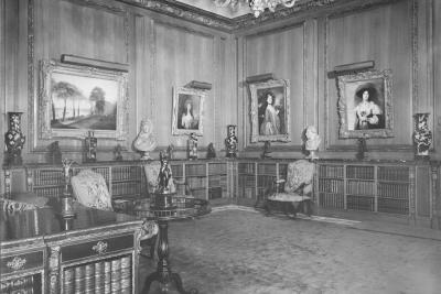 photo of library room with paintings and short bookcases, circa 1942