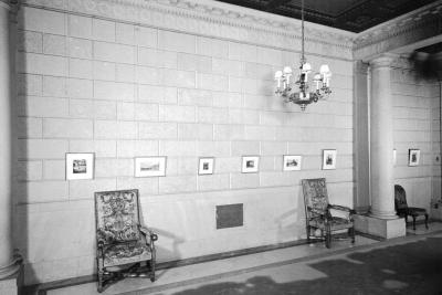 photo of hallway with chairs, chandelier and small pictures, circa 1942