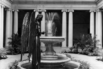 photo of garden court with angel sculpture and fountain, circa 1946
