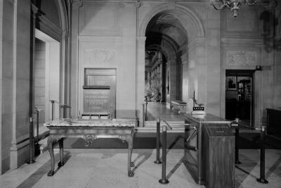 photo of entrance hall with till, table, contribution box and contribution sign