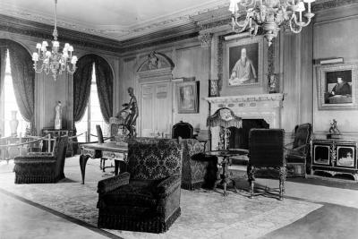 photo of room with chairs, chandeliers, tables, sculptures, circa 1935