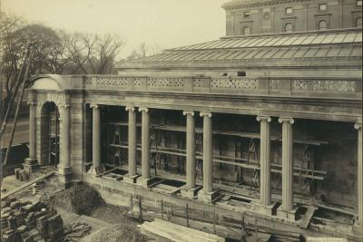 photo of portico or stone porch under construction, with scaffolding, lumber, bricks circa 1913