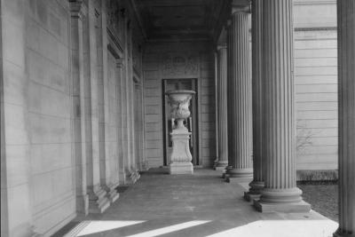 photo of portico or stone porch with columns with sun shining though, circa 1933