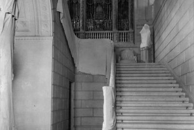 photo of grand staircase prepared for construction, with some protective cloth, circa 1933