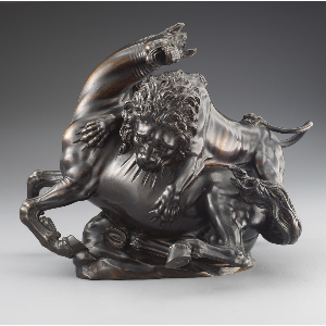 bronze sculpture of lion biting a horse