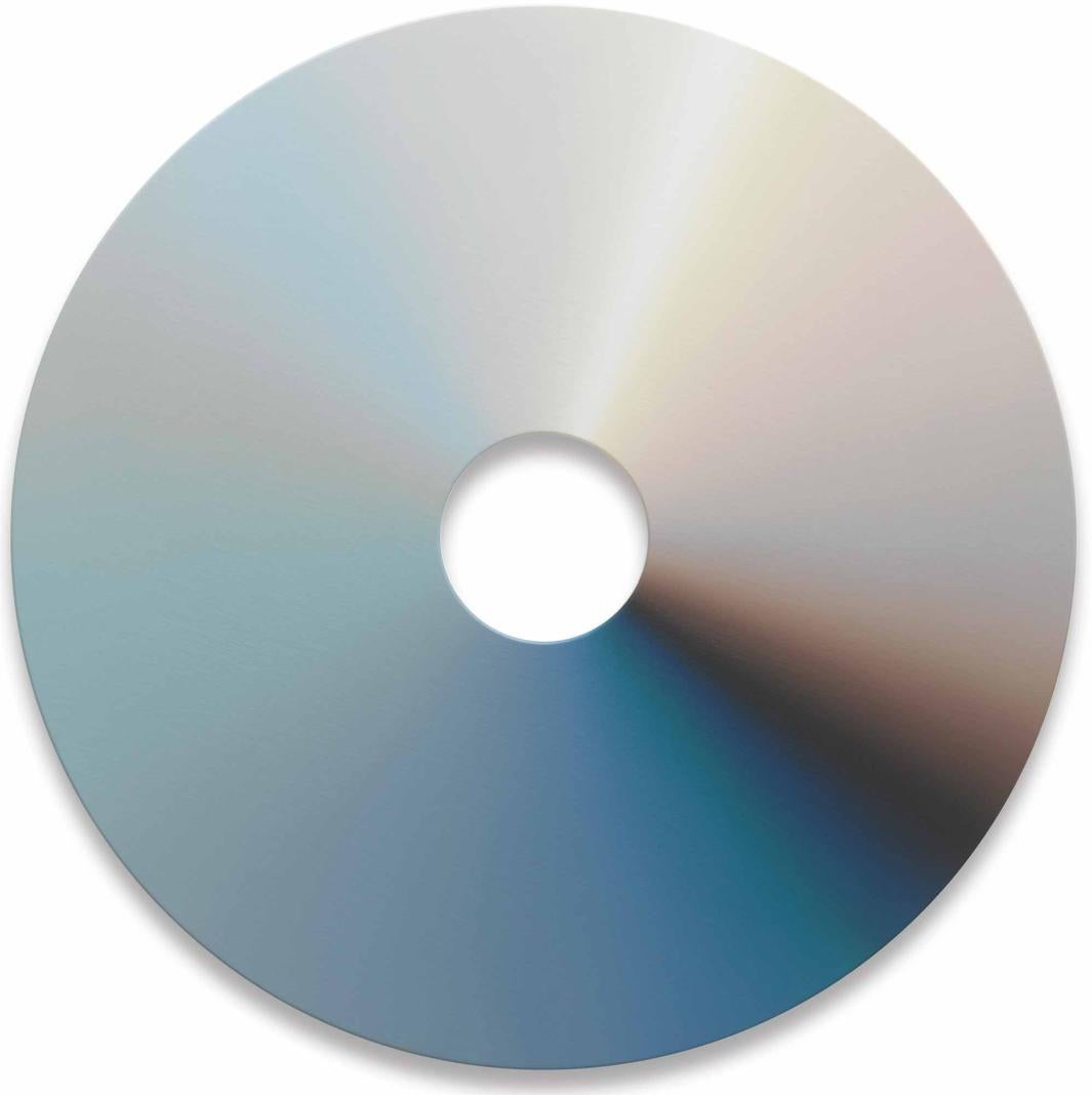 round canvas with hole at center displaying some color spectrum