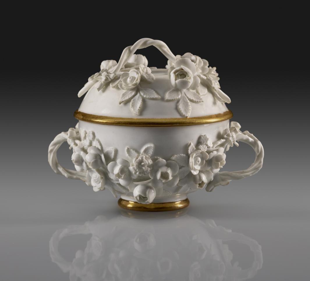 photo of white porcelain bowl with handles and gold trim