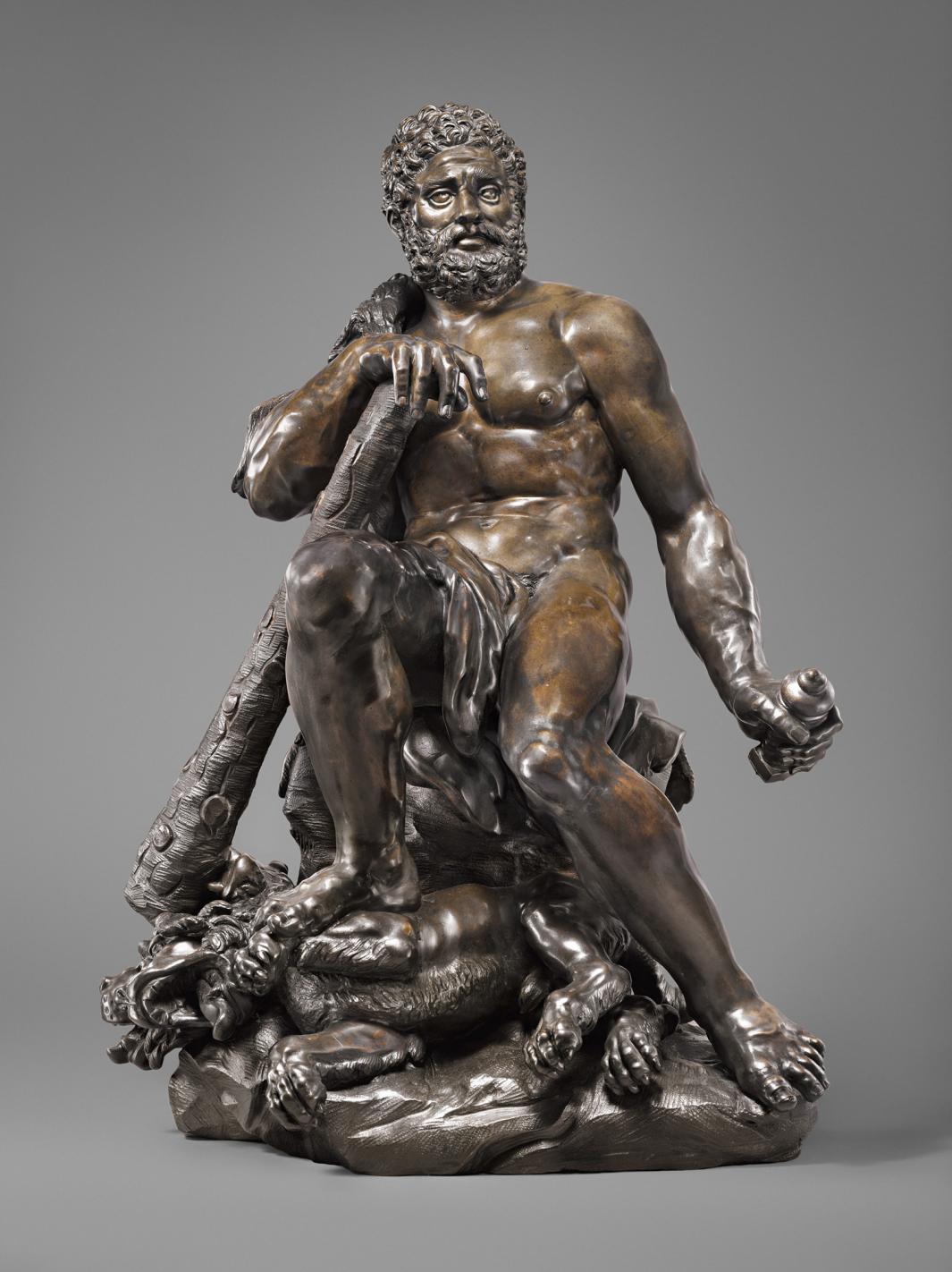 Bronze sculpture of seated male figure with a club.