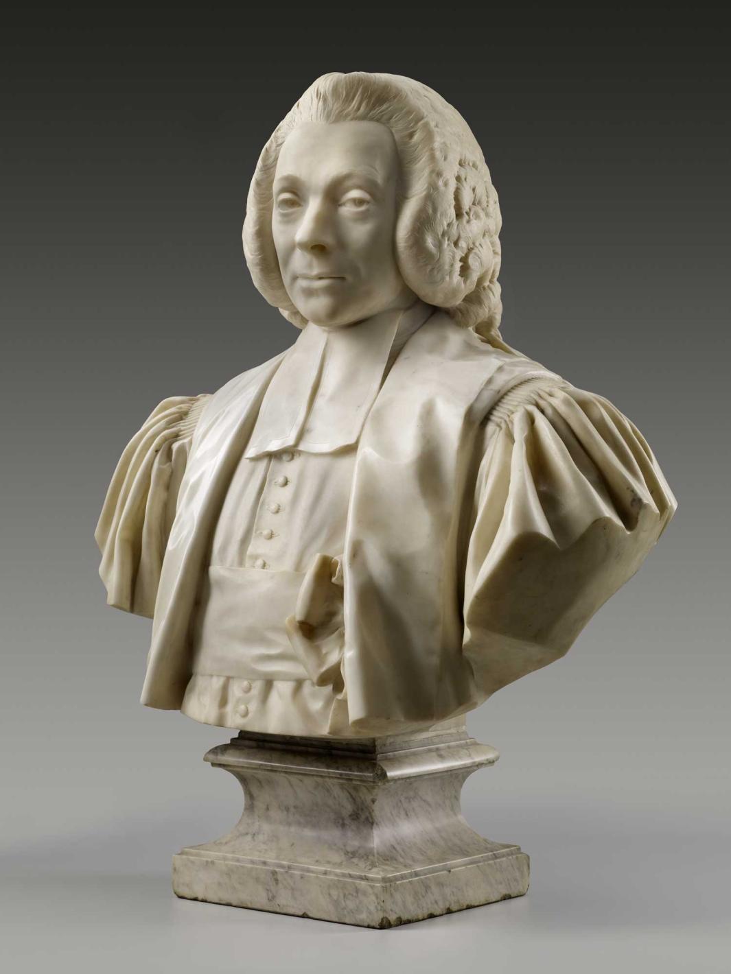 Alternate view of a marble bust of a man wearing a wig, robe, and bow-tied sash