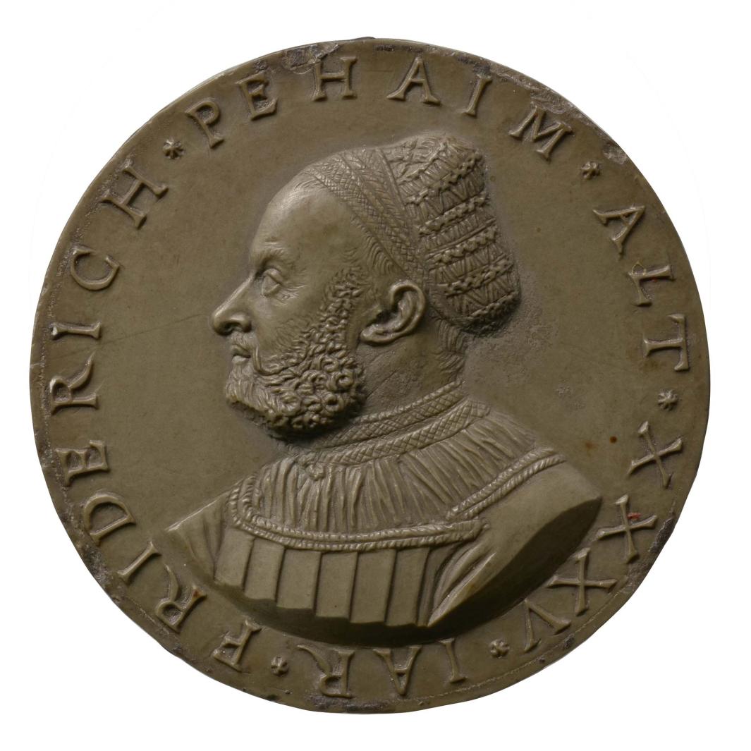 Stone model for a portrait medal of Friedrich Behaim wearing a hat over a bald head, bearded, in profile to the left