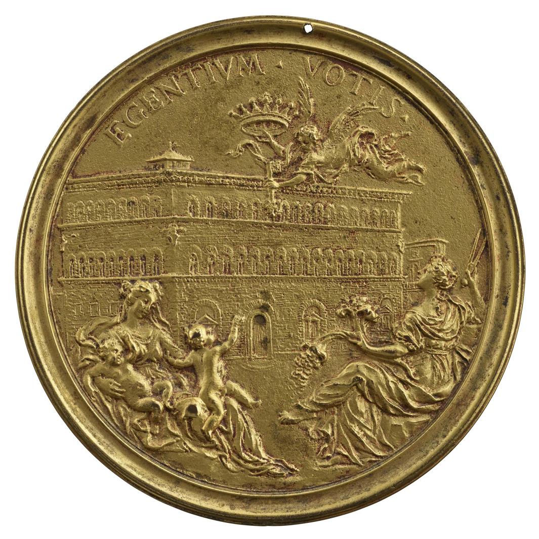 Gilt bronze medal of a large building. Above the building, an angel flies, holding a large crown and key. In front of the building, on the left, a woman reclines, holding two naked children. On the right, a second woman reclines, holding branches and a fan