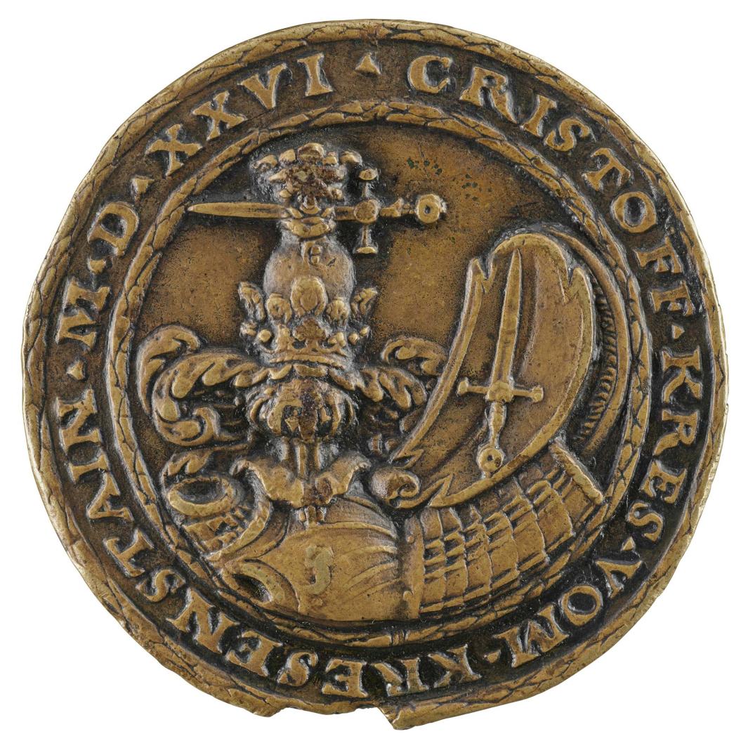 Bronze medal of the Kress family arms with helmet and crest resting on a suit of armor