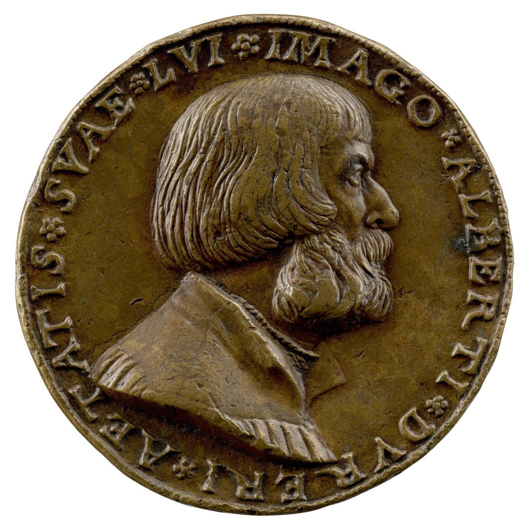 Copper medal of a man in profile wearing a high-necked shirt and doublet