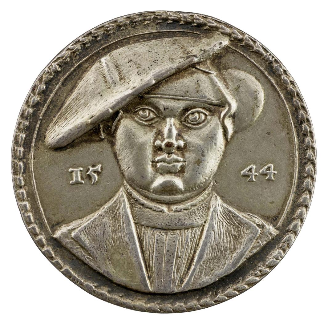 Silver medal of a woman wearing a widow’s bonnet and cap