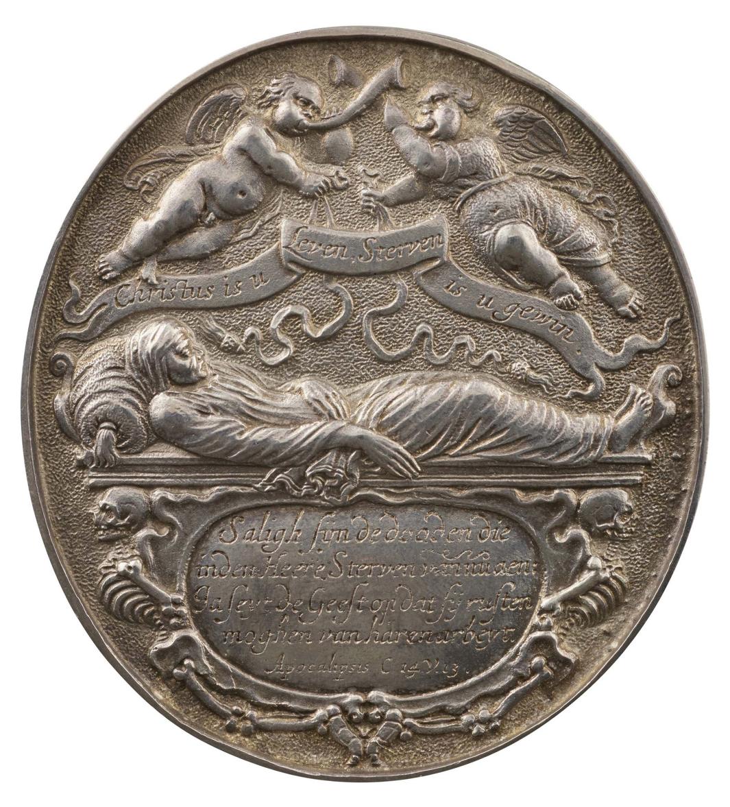 Silver medal depicting two flying genii, one clothed and one nude, sounding horns, each holding a ribbon ending in a tassel and a banner; below, a corpse wrapped in a shroud and resting, head supported by a bolster, on a tomb; beneath, a cartouche flanked by two contorted skeletons 