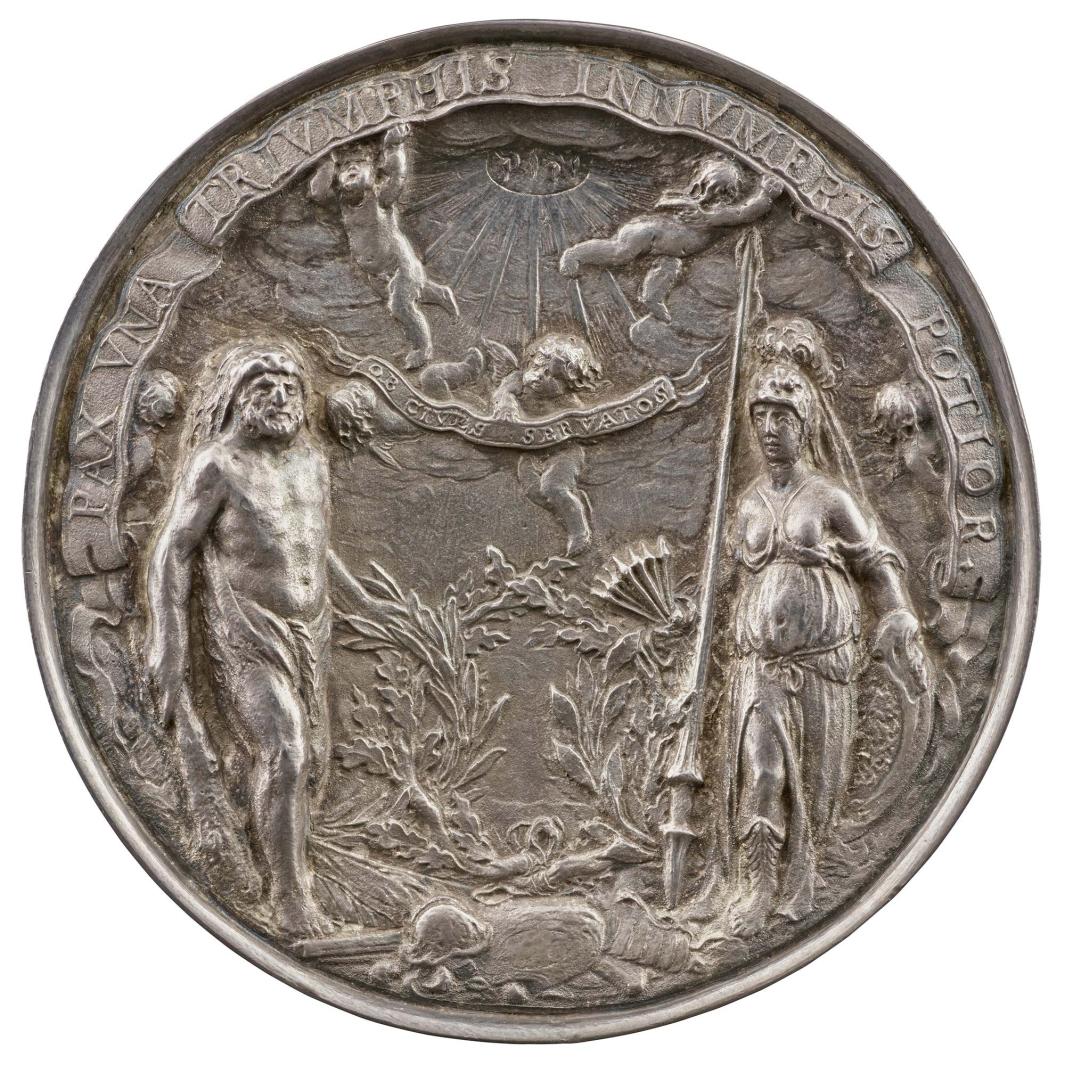 Silver gilt medal of Hercules and Minerva standing on either side of a pile of weapons and armor; between them, two branches, oak and olive, are tied together. In her right hand, Minerva holds seven arrows representing the seven provinces of the Netherlands. Above, heavenly rays emanate from the name of Jehovah in Hebrew. Two cherubs support a banderole. In the center of the field, two other cherubs hold a smaller banderole