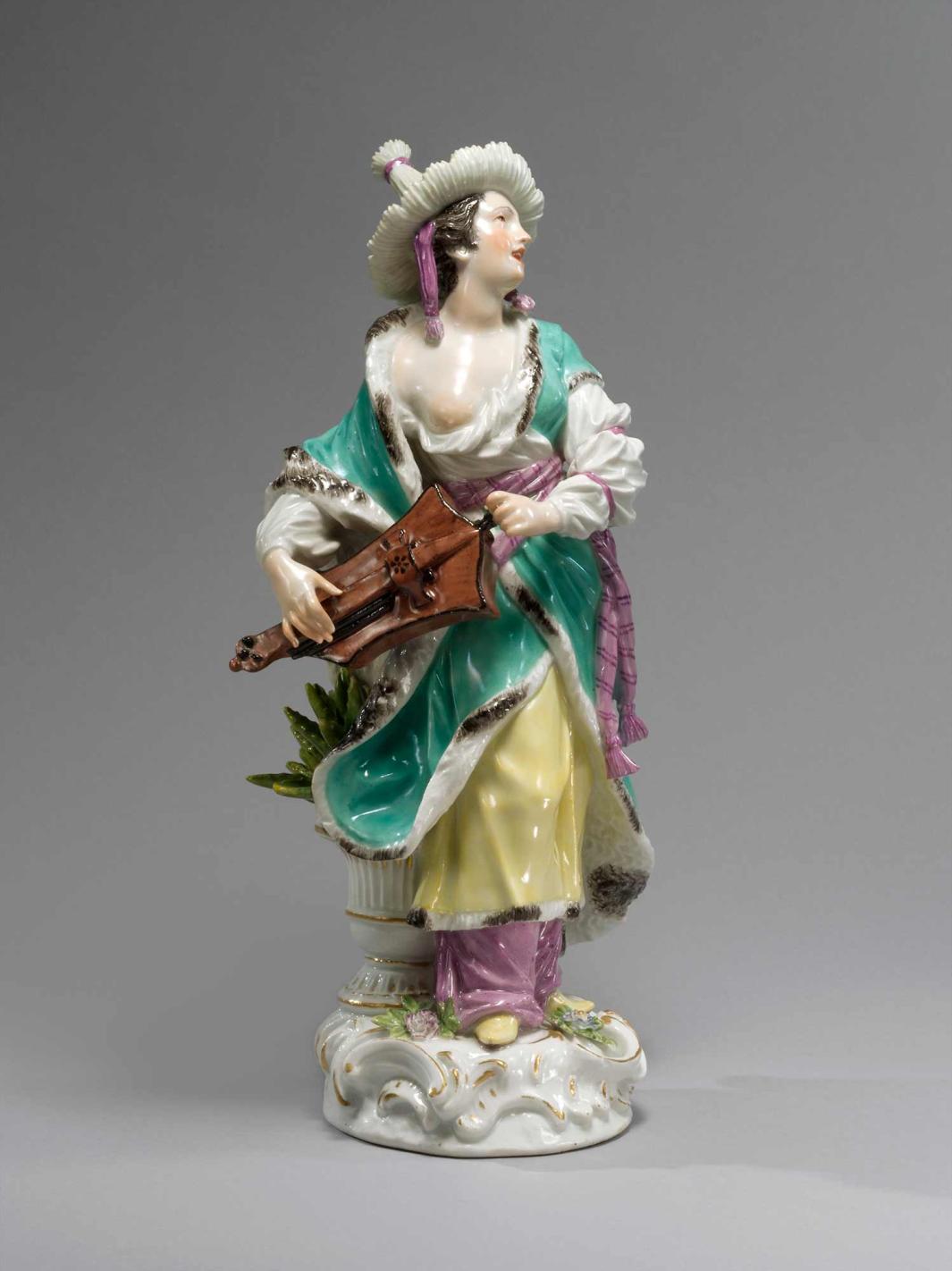 colorful porcelain female figure holding musical instrument