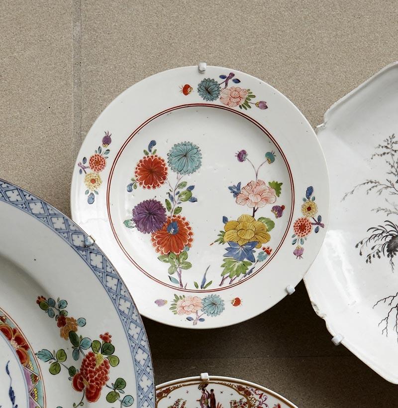 closeup of white porcelain plates decorated with flowers