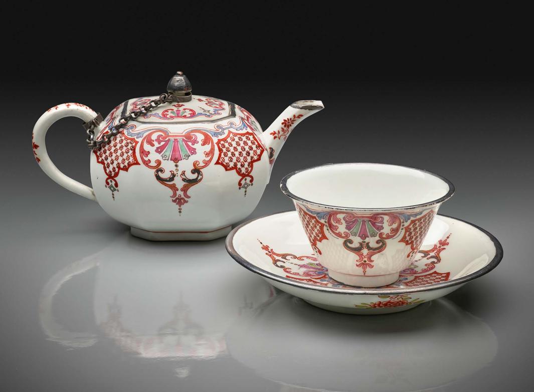 porcelain teapot, cup and saucer, decorated in red patterns