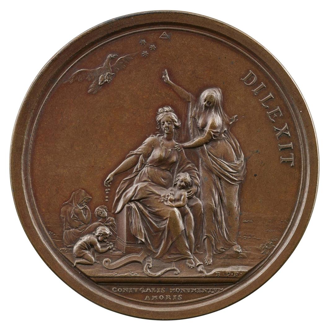 Bronze medal of a veiled woman standing with her right hand on the shoulder of seated a woman 