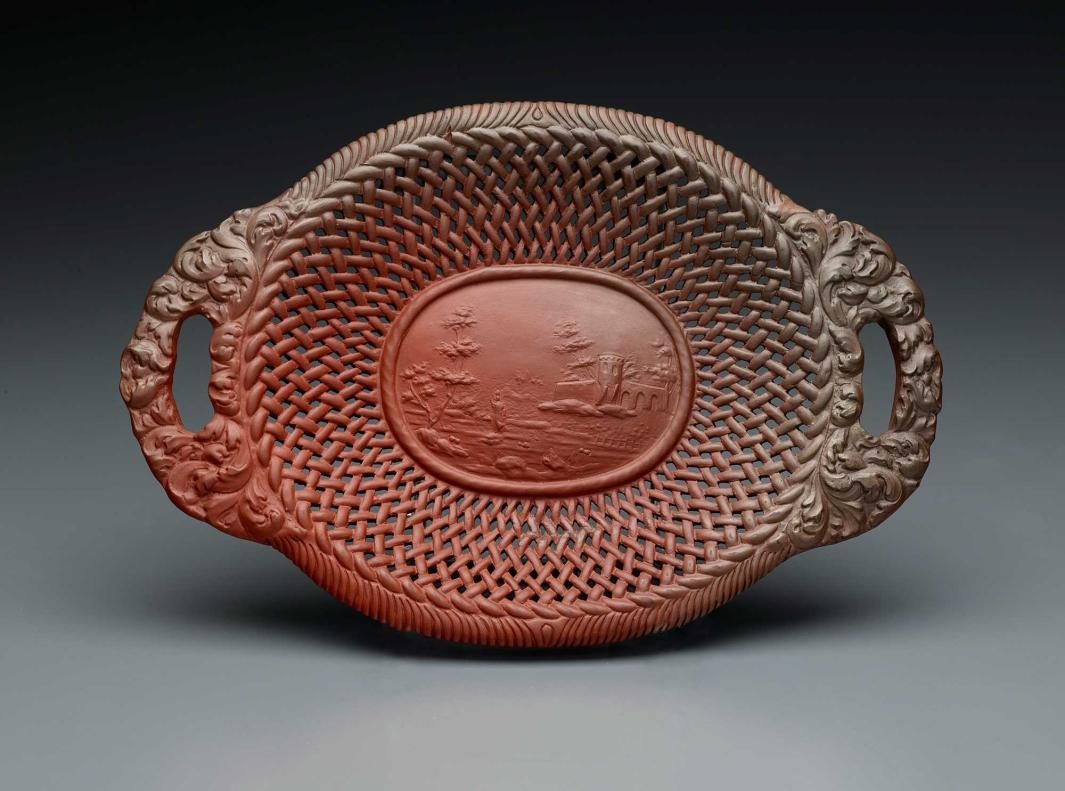 Brown, oval-shaped basket with handles