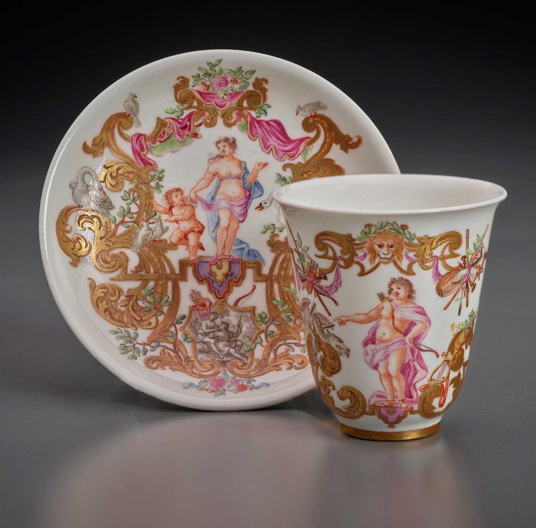 tea cup and sacuer with elaborate gilded decoration