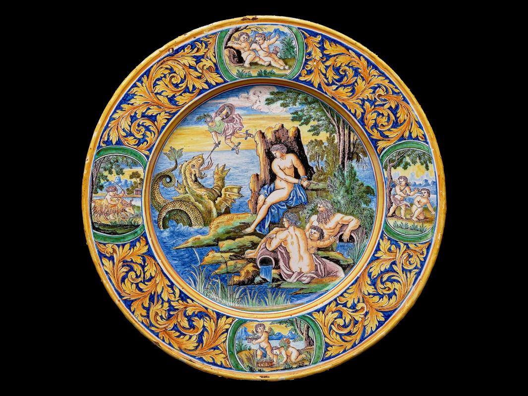 Earthenware plate with a scene of nude figures on an island while a flying figure fights a sea monster
