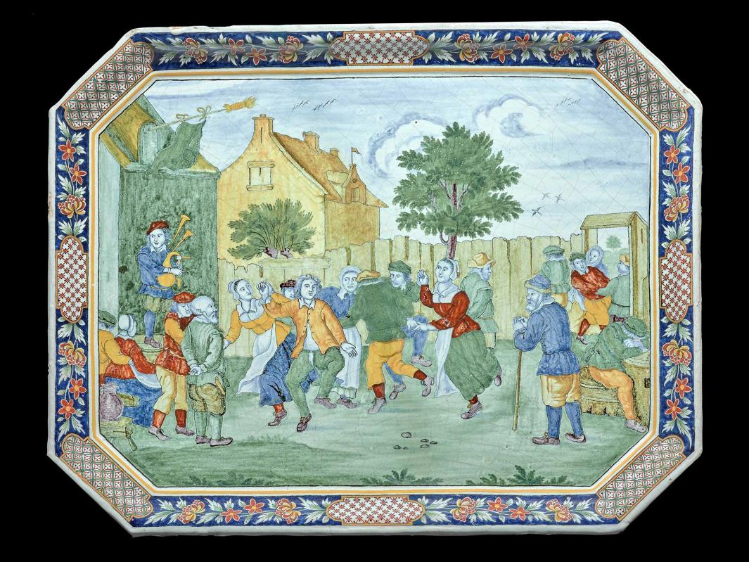 Earthenware tray depicting a scene of people dancing